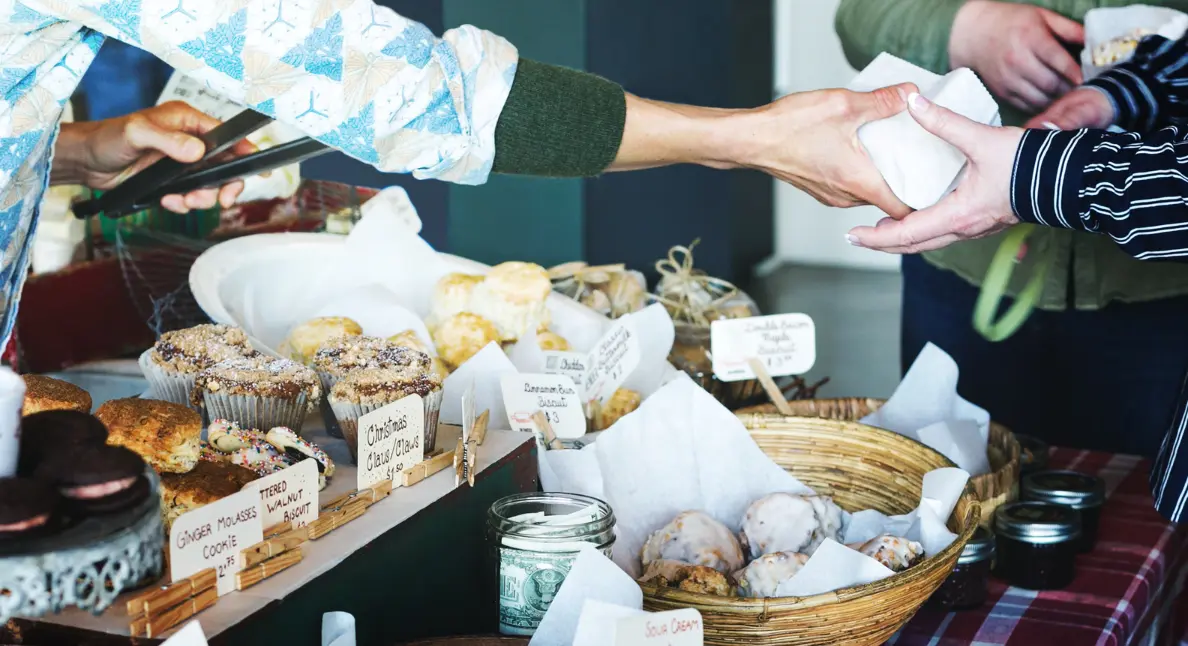 Organic food stores offering fresh homemade pastries and baked goods at a community market.