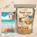 Whole grain GrainBooster shake mix displayed next to Weight Loss Smoothies book with colorful drink options.