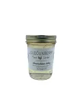 Moonshine jelly in a small mason jar from Loudounberry Farm with a clear golden color and simple label.