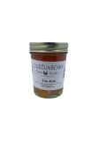 Citrus jam in a mason jar labeled “Toe Jam” from Loudounberry Farm, with a golden-orange hue and metal lid.