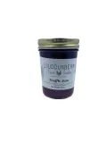 Berry jam in a glass jar labeled “Traffic Jam” by Loudounberry Farm, showcasing a rich dark purple color.