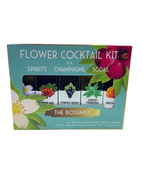 Flower syrup bottle labeled as “Flower Cocktail Kit” by Caufield, featuring floral-infused heat in a glass container.