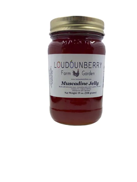 Muscadine jelly in a glass jar from Loudounberry Farm featuring deep red color and classic white label.