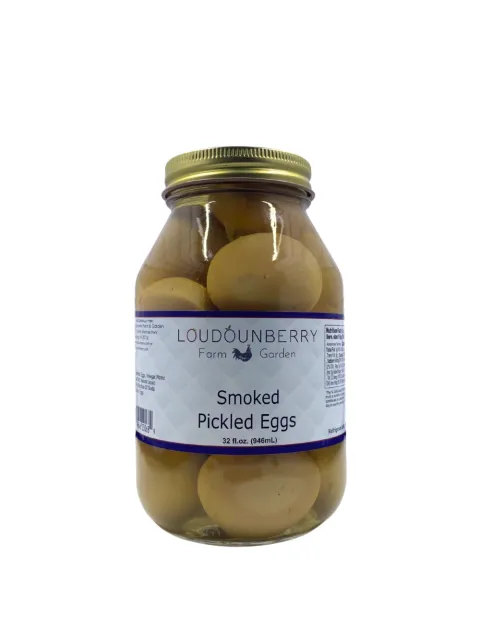 Pickled eggs in a large glass jar from Loudounberry Farm, labeled smoked and packed in brine.